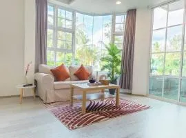 Cozy 1BR apartment by beach - partial ocean view