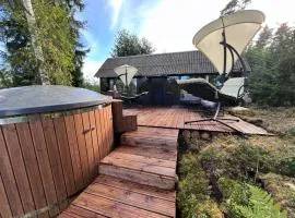Black house in the forest with Hot Tube and Home theater for movies