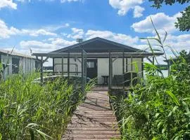 Chalet Bootshaus auf dem See by Interhome