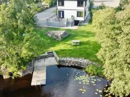 Holiday house by riverside with sauna and hottub