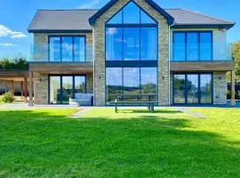 Stunning modern home set in beautiful grounds.