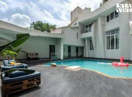 StayVista at Bayside Oasis with Outdoor Pool, WiFi