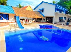 Escapada al mar en playa Mendoza atlantico con 7 habitaciones comodas，位于哥伦比亚港的酒店