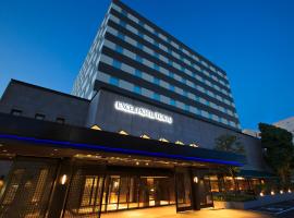 松江东优美好酒店，位于松江市的带停车场的酒店