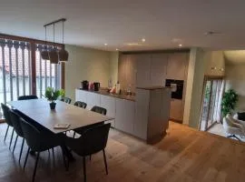 Visionary Hospitality Bassersdorf, Zürich - Premium Apartments in Swiss Style with Free Parking, Washer, Kitchen, Terrace, Vaulted Cellar Event Room, Bus Stop, 15' City & Airport