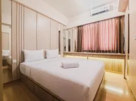Spacious and Homey 2BR at Sky House BSD Apartment By Travelio