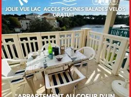 "AU BORD DU LAC" Appartement 4 personnes, village vacances, vue lac, accès parc aquatique