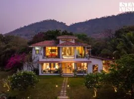 StayVista's House Below The Hill - A stylish Mountain-view villa with Pool and Games room