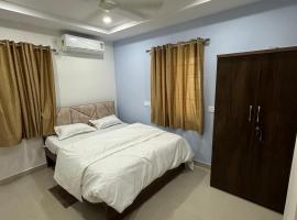 Cosmic Hotel & Guest House Gachibowli Raidurg，位于海得拉巴的住宿加早餐旅馆