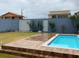 Casa Guriri com piscina ao lado da praia excelente localização，位于圣马特乌斯的酒店