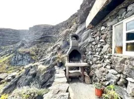 Casa Cueva con vista al mar y barbacoa