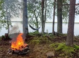 Traditional Finnish lakeside off-grid cabin