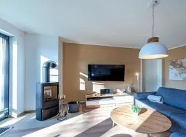 Sonnengruß - Stilvolles Apartment mit Balkon, Kamin & Wellness-Flair am Krakower See