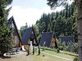 Wooden chalet with terrace near a swimming lake