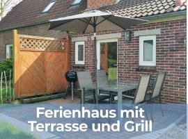 Ferienhaus Oll Smee 9 Huus EEN mit Terrasse, Grill und kleinem Garten，位于韦尔杜姆的酒店