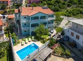 Apartments and rooms with a swimming pool Senj - 23592