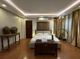 The Guest Room at Anahaw Estates Davao，位于达沃市的带热水浴缸的酒店