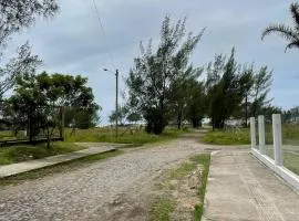 Casa pé na areia em capão da canoa