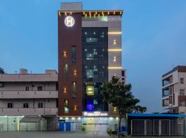 Hotel wood land grand，位于贡土尔的酒店