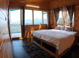 Cabin by The Woods - Mukteshwar - Hillside - Romantic，位于穆克缇斯瓦的酒店