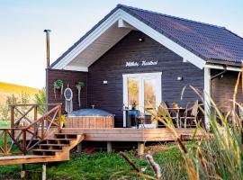 Milkės Karibai - poilsio namelis su sauna ir kubilu，位于Statiškė的酒店