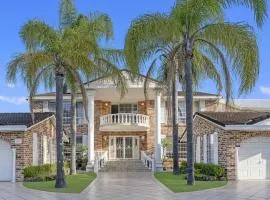 Stunning 4BR Holiday Home with Water Views & Pool