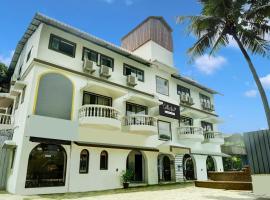 Super Collection O Candolim Near Candolim Beach，位于坎多林的酒店