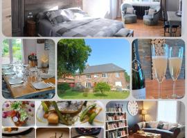 Les R&ecirc;ves de Baie de Somme Chambres d'h&ocirc;tes , Table d'h&ocirc;tes et Spa，位于B&eacute;hen的带热水浴缸的酒店