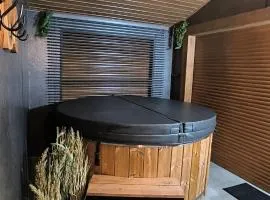 Domki Spokojny Zakątek z balią z jacuzzi