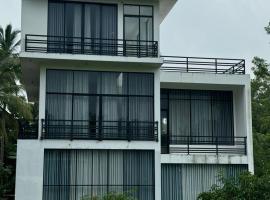Pearl White Residency，位于波隆纳鲁沃的酒店