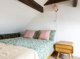 En-suite with double bed on mezzanine and desk in family home