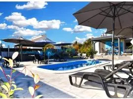 House with a heated pool and a jacuzzi