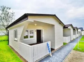 Single-story holiday homes with a terrace, pool