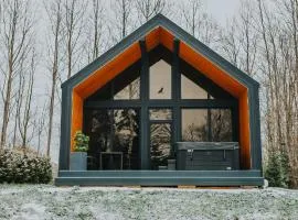Sniegi design cabin with included sauna and jacuzzi