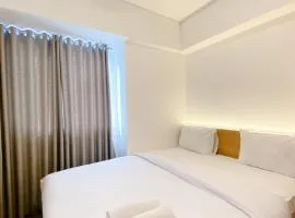 Spacious and Homey 2BR with Work Space at Meikarta Apartment By Travelio