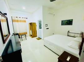 Hmc Leisure House & Restaurant，位于Dondra North的酒店