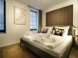 Boardinghaus Grünefeld -W2 - Schöne Serviced Apartments - Küche - Smart TV - P - Premiummatratzen - Rainshower by Wooon，位于Mettingen的酒店