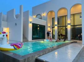 Nacha Pool Villa Cha-am，位于七岩的自助式住宿