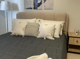 Cozy and Affordable Deluxe Condo near Puerto Princessa Airport，位于公主港的酒店