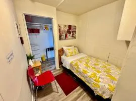 Tiny Private Room at the Upper Level of a Big House with Shared Bathroom