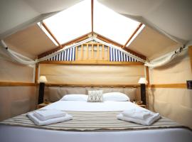 Glamping Italia 90 Mini Lodges，位于多马索的豪华帐篷营地
