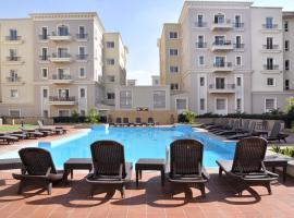 Axxodia- Apartments In Mivida Lake District，位于New cairo的酒店