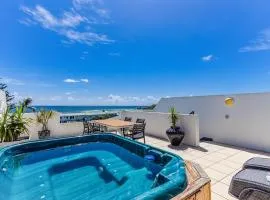 Luxury Oceanfront Haven with a Private Rooftop Spa