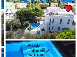 Located by the sea one beachfront Private Captain Lazaros Pool Villa with loft in 750sqm spacious private plot-Jacuzzi-sunrelax-furnished terace-gazebo-private parking,sleep 3 adults and 2 children, just steps from the Black Beach-Seaview