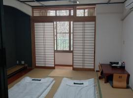 万沢温泉，位于Nambu的酒店