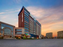 Xi Que Yu Jia Hotel Xinzheng International Airport Branch，位于郑州的酒店