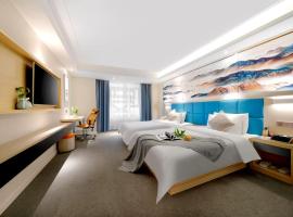 Happy Manju Hotel--Harbin Haxi High-speed Railway West Station Wanda Plaza Branch，位于哈尔滨的酒店