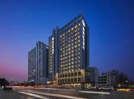 Happy Inn-Zhengzhou Railway St ation Erqi Square Branch喜鹊愉家酒店锦荣国际轻纺城店