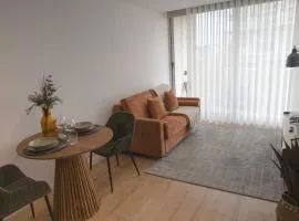 Flat with garage and balcony with view to a garden