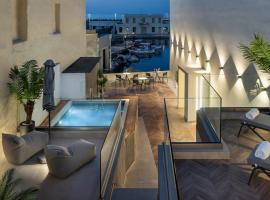 Dea Del Porto Wellness & Spa Suites，位于罗希姆诺的酒店